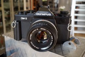 Olympus OM-3 Black + 1.8 / 50mm Zuiko + grip