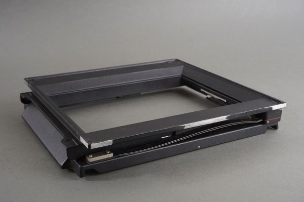 Part of 5×7 Sinar spring loaded film holder back, no screen
