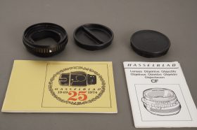 small lot of Hasselblad items: docs, caps, 21mm tube