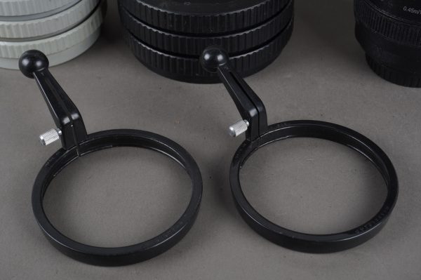 Hasselblad focusing handles lot of 2 + plastic lens keepers bottoms lot of 6 + thermal mug :)