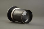 an old PLAUBEL brass lens, tiny