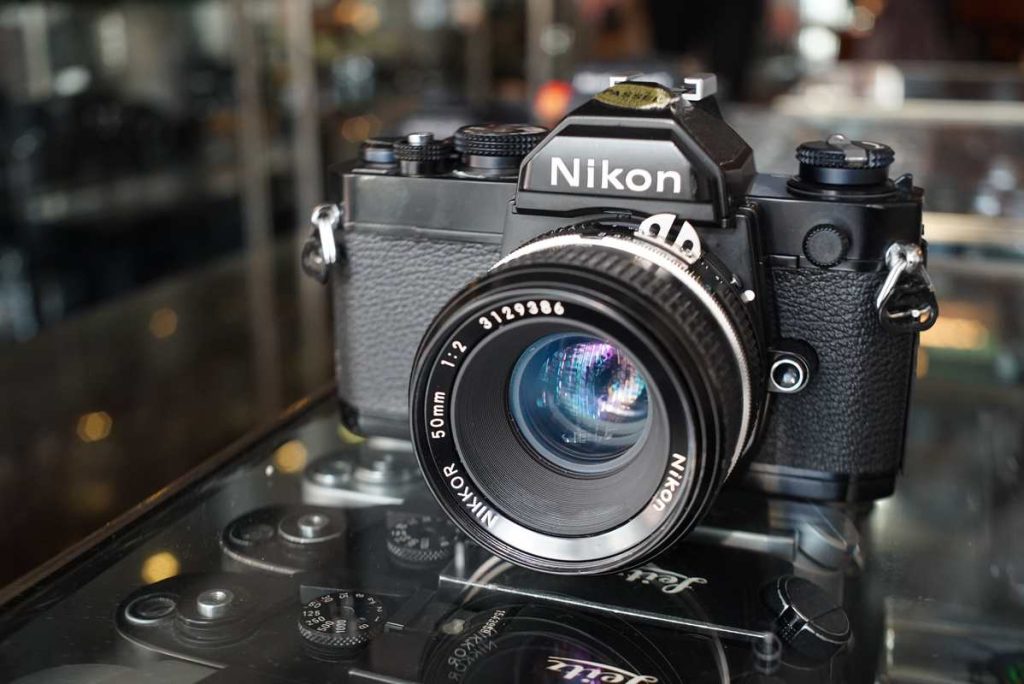 Nikon FM black + E series 50mm F/1.8 lens incl. leather case