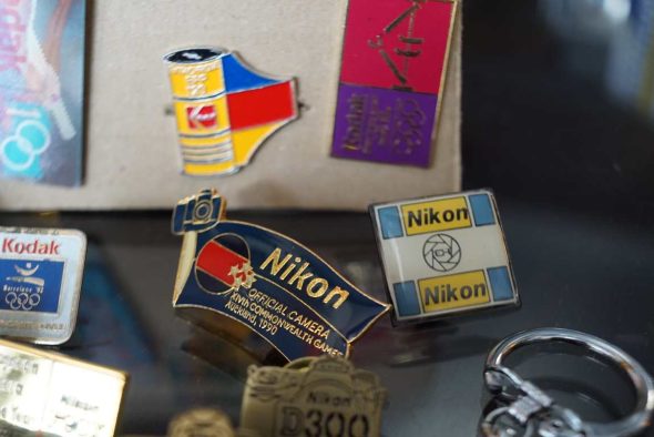 19x Nikon and Kodak related vintage pins and keyrings