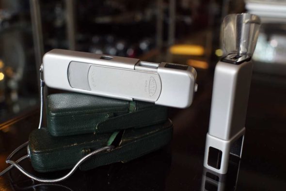 Minox B with flash piece, in green leather cases