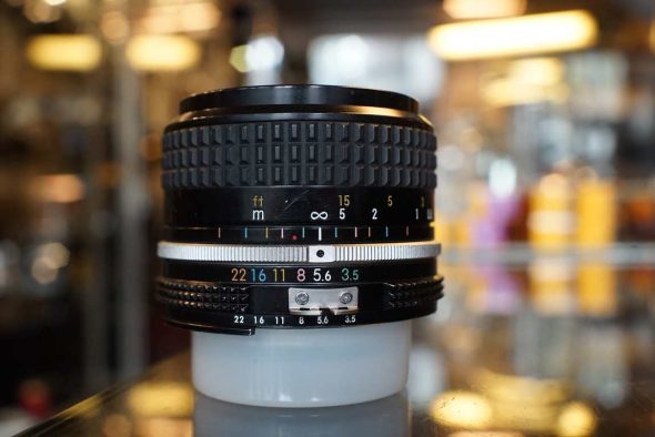 Nikon Nikkor 28mm F/3.5 AI lens, worn + HN-2 lenshood