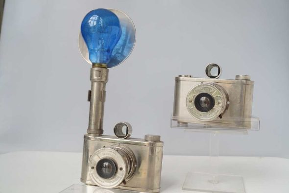 Two Tahbes Synchro cameras, one with flash