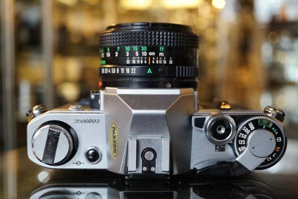 Canon AE-1 chrome + nFD 50mm f/1.8 lens