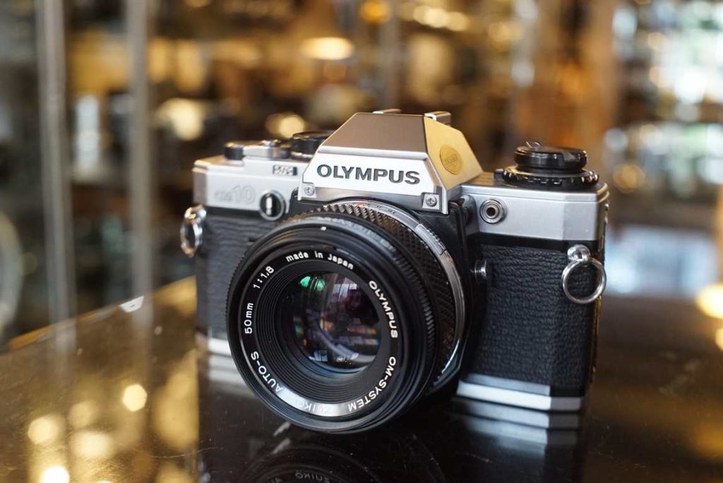 This Olympus OM-10 has jsut been fully checked by our inhouse technician. Everything is working smooth as should.. Seals are light tight. Smooth focus on lens. few internal dust specs not seen on film. nice bright finder. This OM10 kit is a perfect starter kit, ready to shoot