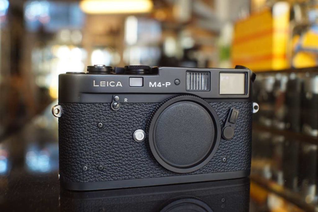 Beautiful Leica M4-P in black, just back from service. Fully disassembled and rebuilt with new greases and the finest adjustments. Everything back to like-new shooting condition. Small dent in toppplate above rangefinder illumination window, purely cosmetic, the dent causes no issues in use. Very nice cosmetics otherwise with only some noticable paintloss on the film door. Perfect alternative to M6 if you dont mind the lack of a meter.Lens not included