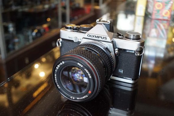 Olympus OM-2 with Tokina zoom lens