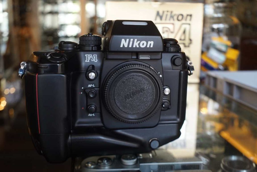 This Nikon F4s kit comes in a beautiful condition. Nearly looks like new and seems never or hardly ever used. The body has excellent cosmetics, no notable wear marks and clean battery compartment. The shutter speeds are all accurate as well as the light meter. No LCD bleeding. One of the nicest F4s kits we've seen in some time. Comes in original packaging with insert. Hard to find in such prestine condition