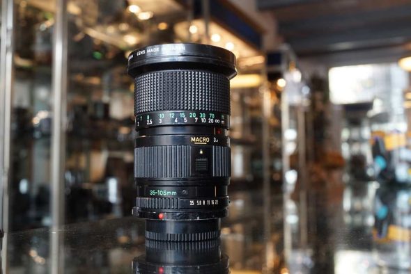 Canon FD 35-105mm f/3.5 zoom lens worn