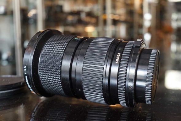 Canon FD 35-105mm f/3.5 zoom lens worn