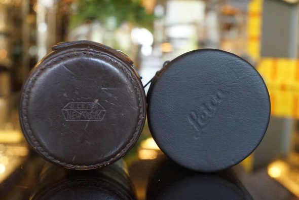 Pair of Leather Leica lens cases. old and new