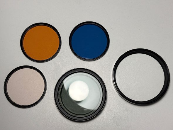 Lot of various Minolta lens filters including MD 100-500mm close-up lens