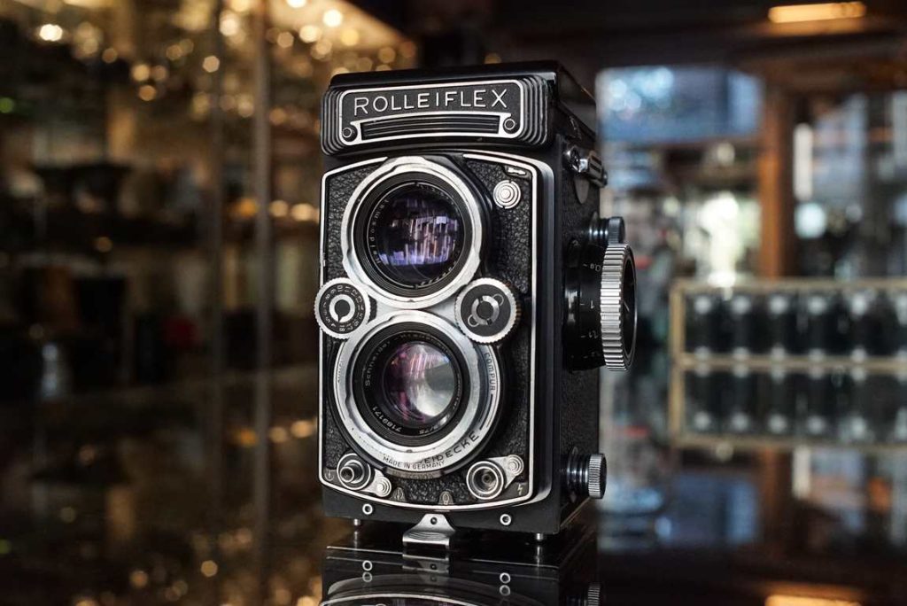 This Rolleiflex 3.5 E2 is quite a uncommon variant of the Rolleiflex, basically being a Rolleiflex 3.5F without meter but with both hints of a 3.5F and E model. According to online sources only a number of around 4000 was made of this one for the UK/US market. It features a Schneider Xenotar f/3.5 lens. The camera received a service from the well known Rollei expert Hans Klinkhamer and now everything works lovely again. The camera received a full service and the shutter now works accurately again on all speeds. The focus was also lubricated and calibrated. The focusing screen has a gridline and finder opens and closes properly. Optics of the lenses are in excellent shape and have been cleaned during the service. A truely uncommon camera that also is now ready again for a second life. No front cap included but these can be easily found online.this item comes with a 3 month limited warranty