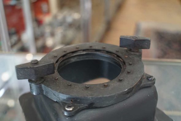 Iris lens mounting clamp. For small brass lenses