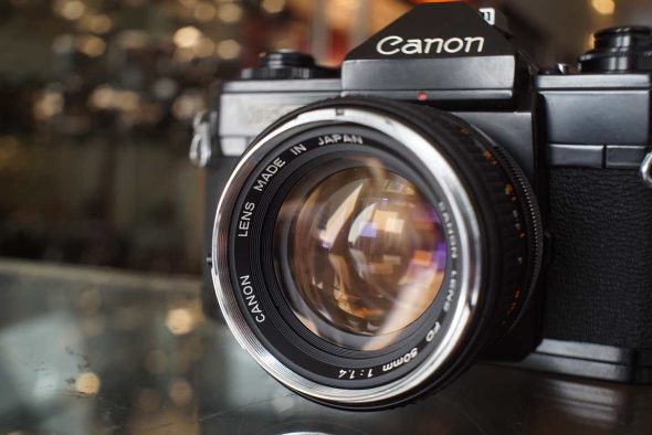 Canon EF + Canon FD 50mm f/1.4 Chrome nose, with remarks