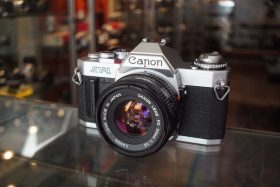 Canon AV-1 + newFD 50mm f/1.8 w/ hood
